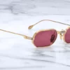 Sunglasses Model The Sidewalk Doctor in Gold with Magenta lenses in collaboration with Enfants Riches Déprimés for Jacques Marie Mage