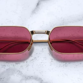 Sunglasses Model The Sidewalk Doctor in Gold with Magenta lenses in collaboration with Enfants Riches Déprimés for Jacques Marie Mage