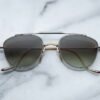 Sunglasses Model Flynn in Color Electrum with Light Blottle Green Lenses from Jacques Marie Mage
