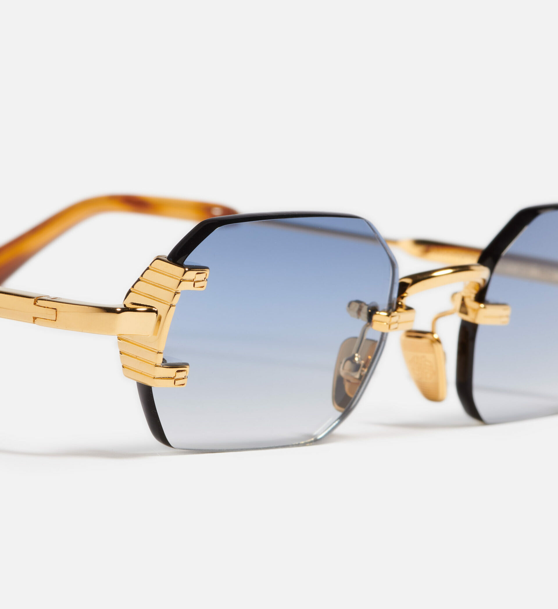 Sunglasses Model Amaru in Color C500 with Light Blue gradient lenses from John Dalia