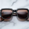 Sunglasses Model Taos in Color Noir X with Orange lenses from Jacques Marie Mage