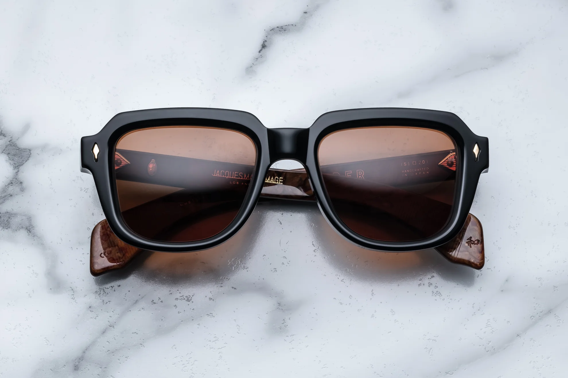 Sunglasses Model Taos in Color Noir X with Orange lenses from Jacques Marie Mage